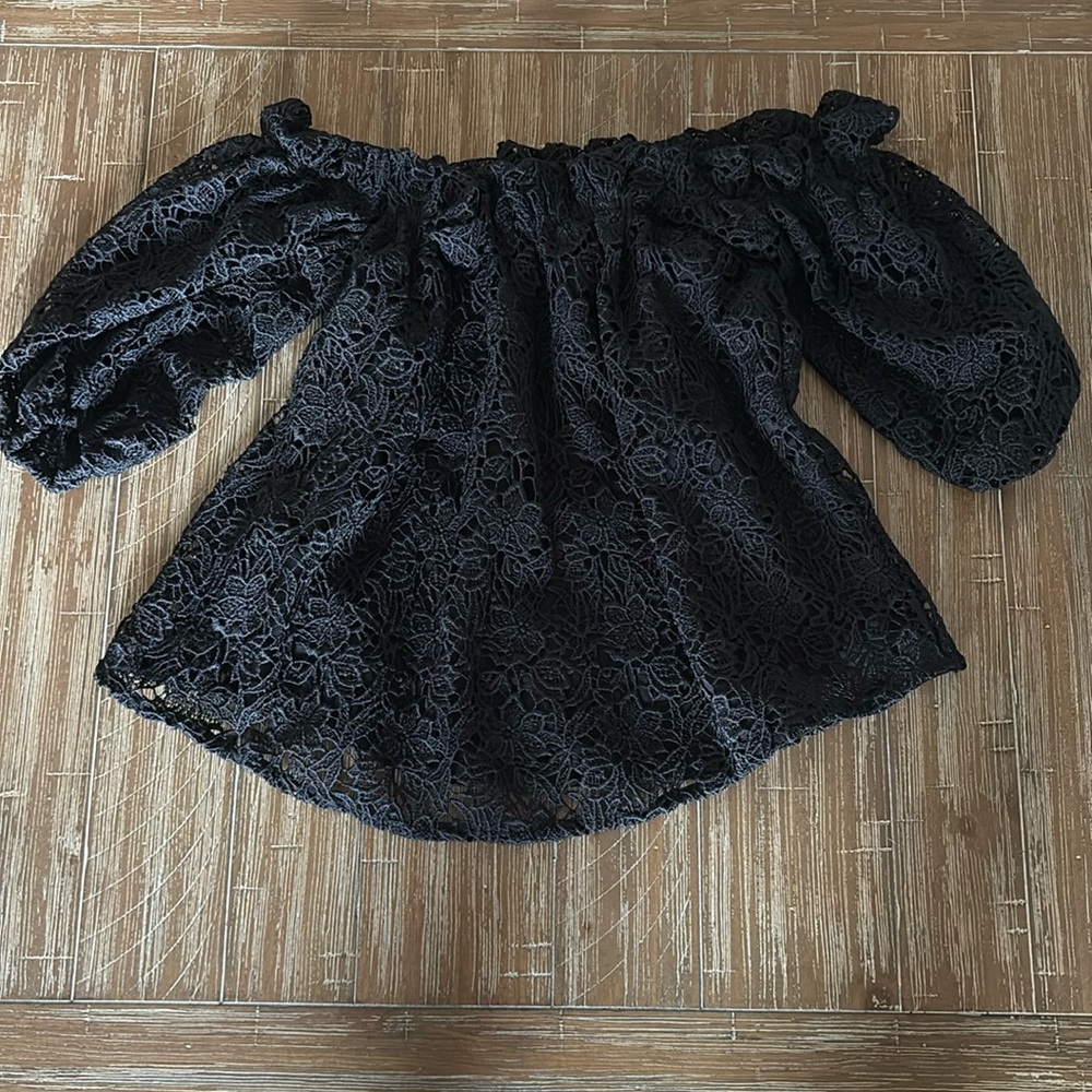 Adorable off shoulder black top from Anthropologie!